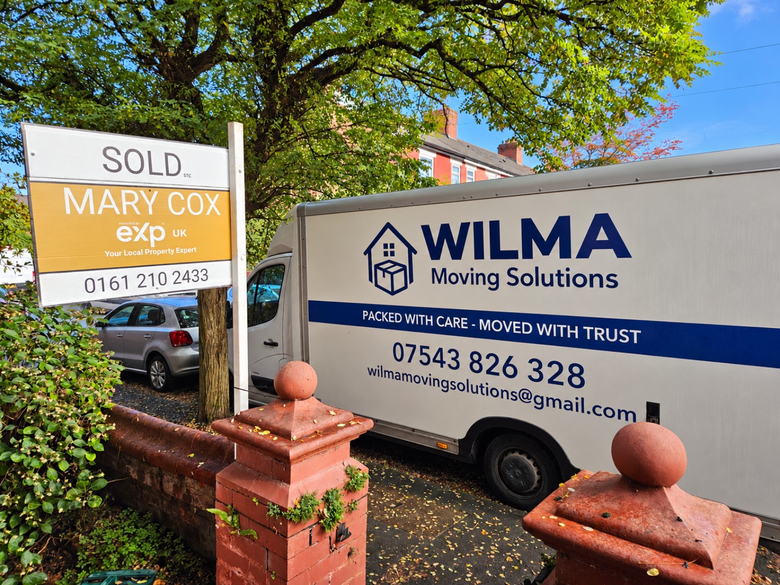 Wilma Moving Solutions van alongside a Mary Cox Estate Agents SOLD sign