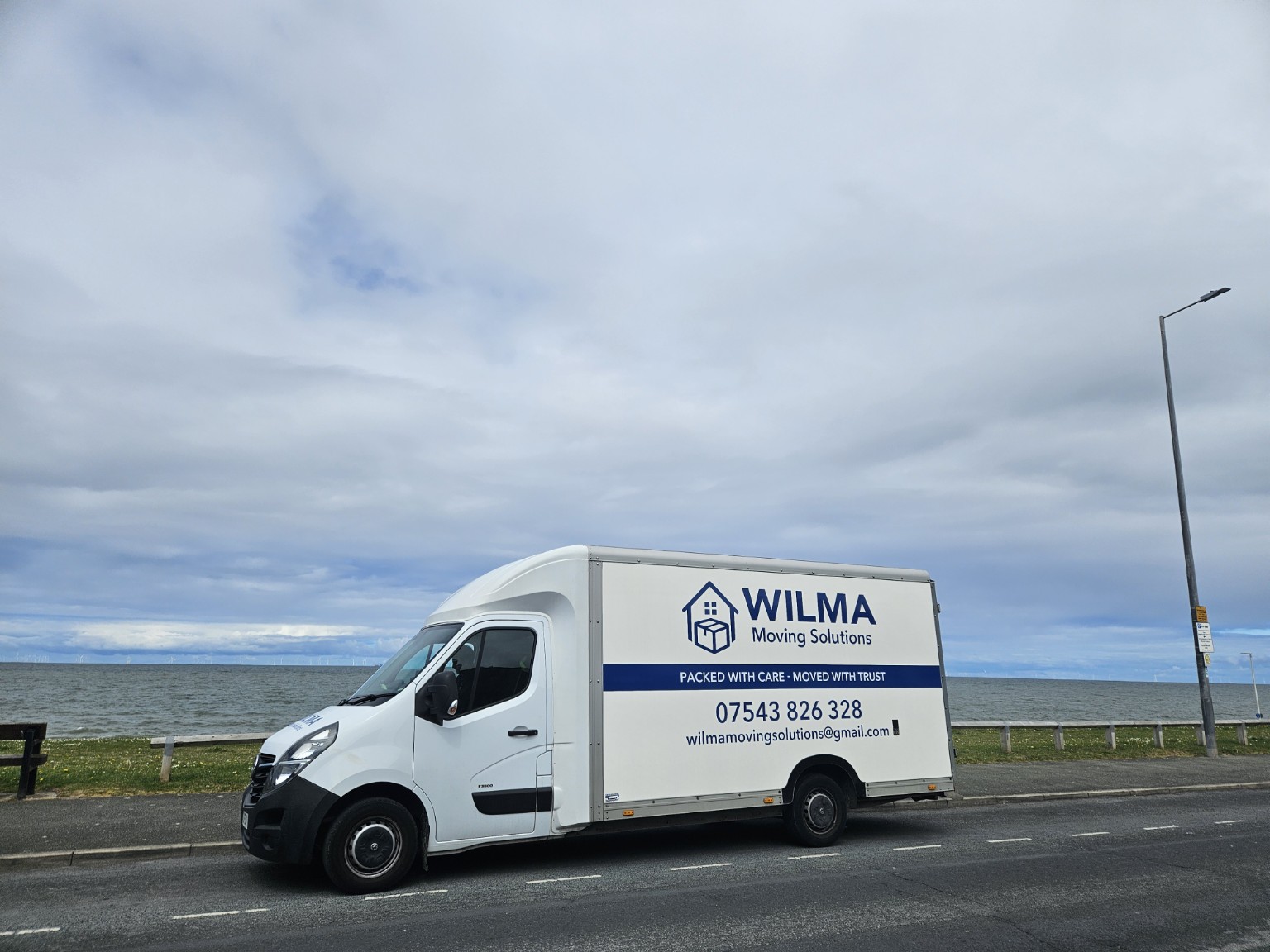 Wilma Moving Solutions van out on the road